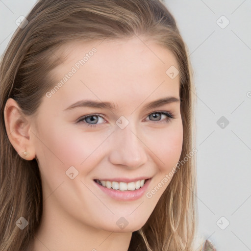 Joyful white young-adult female with long  brown hair and blue eyes