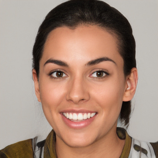 Joyful white young-adult female with medium  brown hair and brown eyes