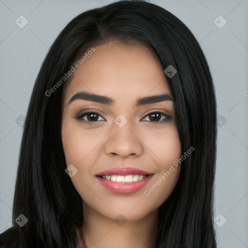 Joyful latino young-adult female with long  black hair and brown eyes