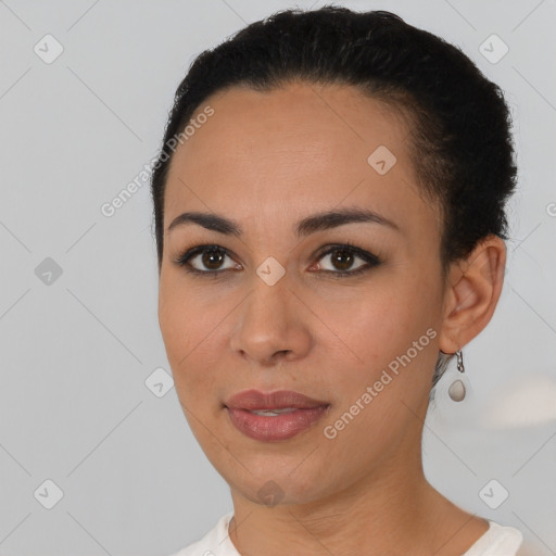 Joyful latino young-adult female with short  black hair and brown eyes