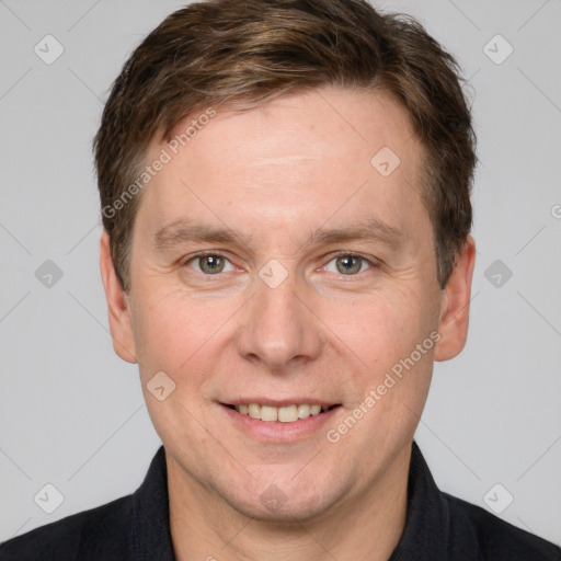 Joyful white adult male with short  brown hair and grey eyes