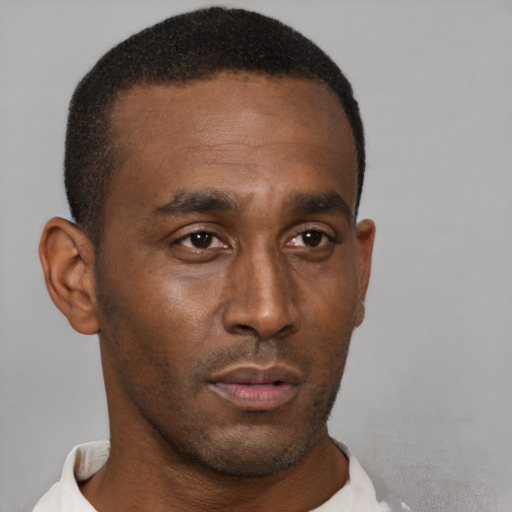 Neutral black young-adult male with short  brown hair and brown eyes