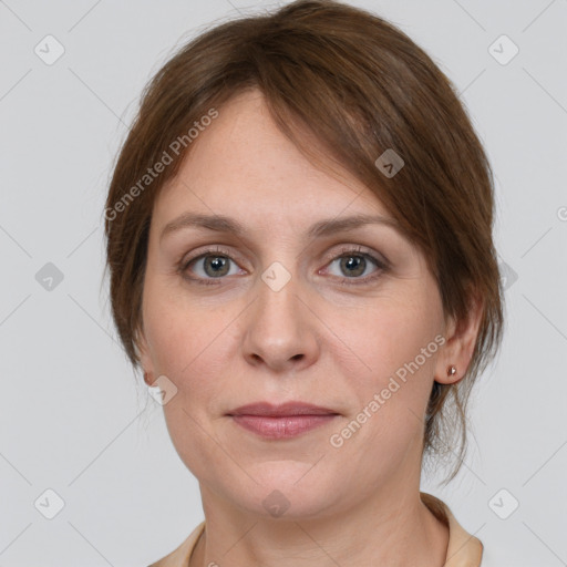 Joyful white young-adult female with medium  brown hair and grey eyes