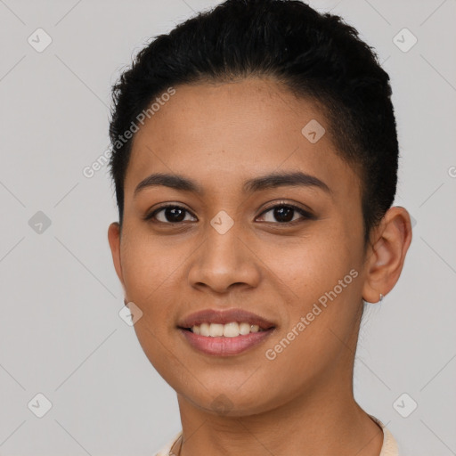 Joyful latino young-adult female with short  brown hair and brown eyes