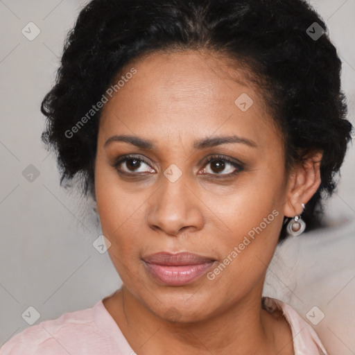 Joyful latino adult female with short  brown hair and brown eyes