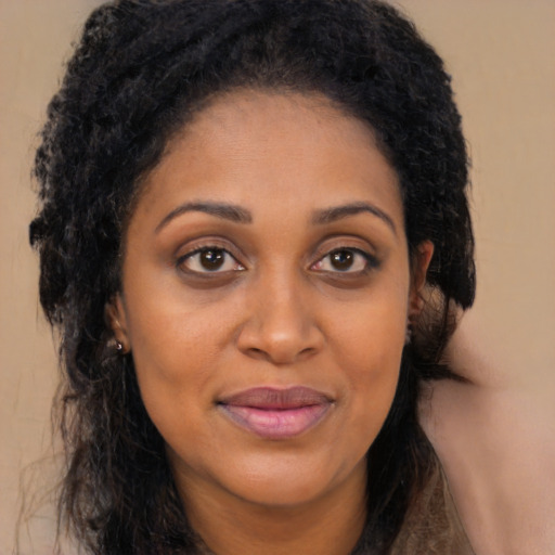 Joyful latino young-adult female with long  brown hair and brown eyes