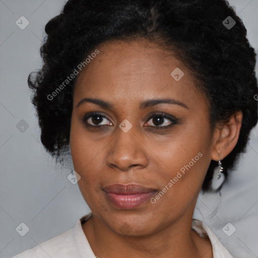 Joyful black adult female with medium  brown hair and brown eyes