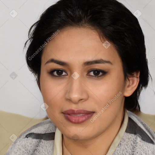 Joyful latino young-adult female with medium  brown hair and brown eyes