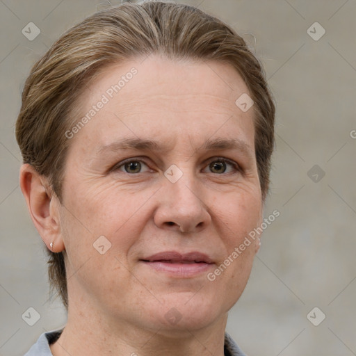 Joyful white adult female with short  brown hair and grey eyes