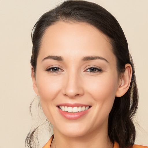 Joyful white young-adult female with medium  brown hair and brown eyes