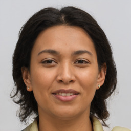 Joyful asian adult female with medium  brown hair and brown eyes