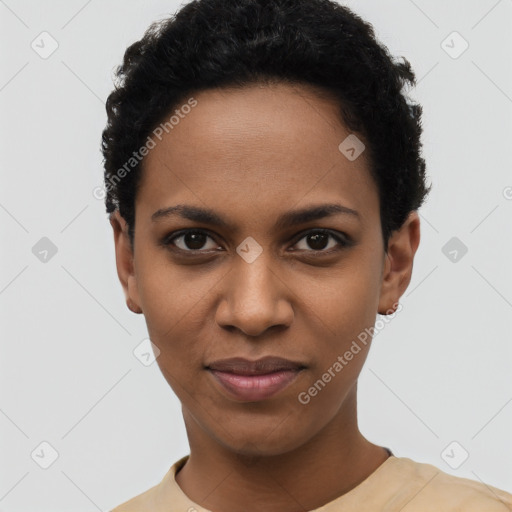 Joyful black young-adult female with short  black hair and brown eyes