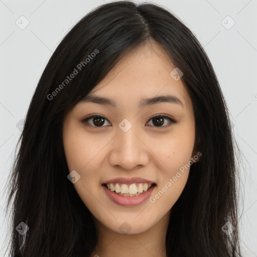 Joyful asian young-adult female with long  brown hair and brown eyes