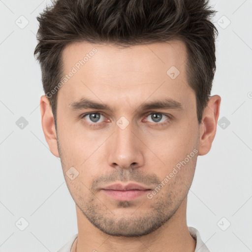 Neutral white young-adult male with short  brown hair and brown eyes