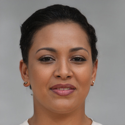 Joyful latino young-adult female with short  brown hair and brown eyes