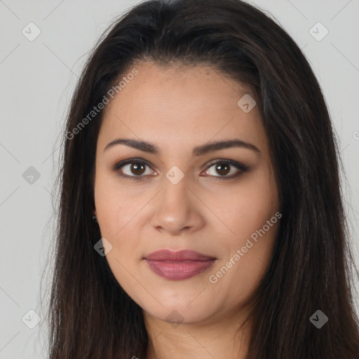 Joyful latino young-adult female with long  brown hair and brown eyes