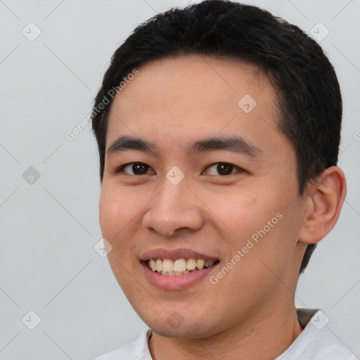 Joyful white young-adult male with short  black hair and brown eyes