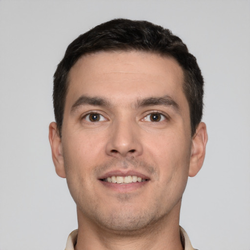 Joyful white young-adult male with short  brown hair and brown eyes