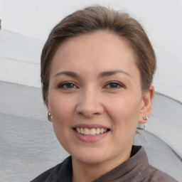 Joyful white young-adult female with short  brown hair and brown eyes