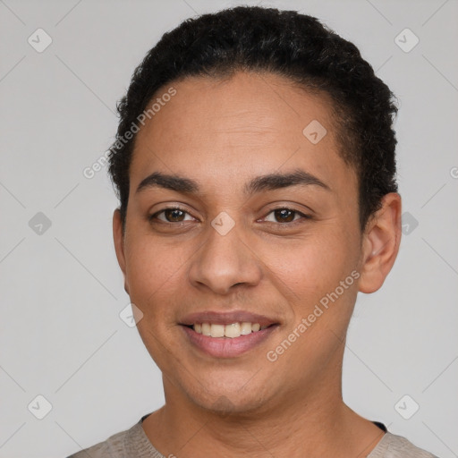 Joyful latino young-adult female with short  black hair and brown eyes