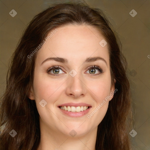 Joyful white young-adult female with long  brown hair and green eyes