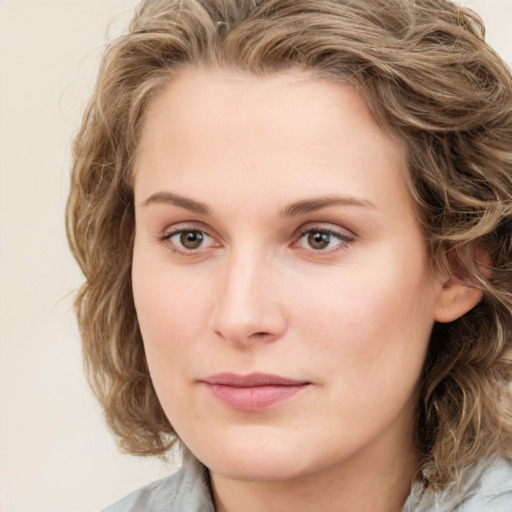 Neutral white young-adult female with medium  brown hair and blue eyes