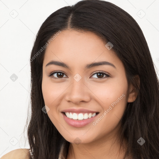 Joyful latino young-adult female with long  brown hair and brown eyes