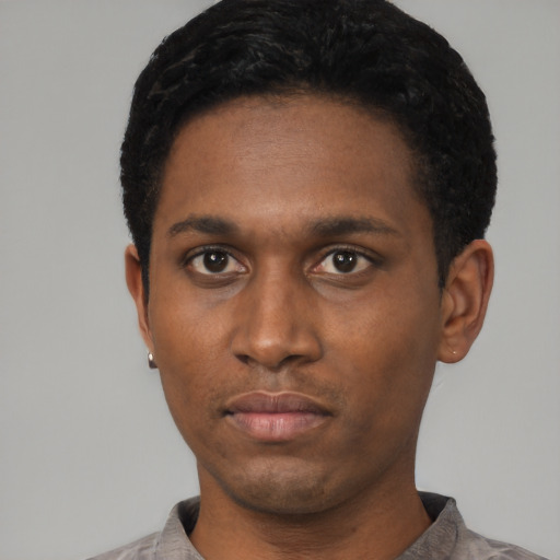 Neutral black young-adult male with short  black hair and brown eyes