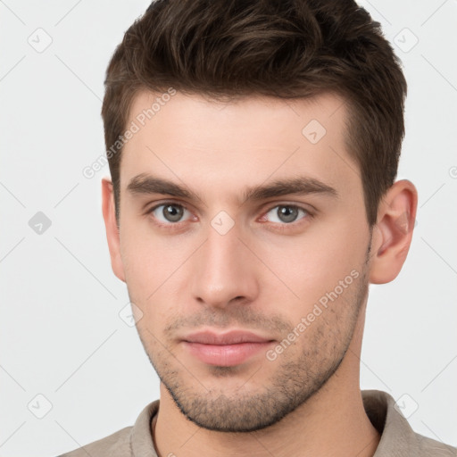 Neutral white young-adult male with short  brown hair and brown eyes