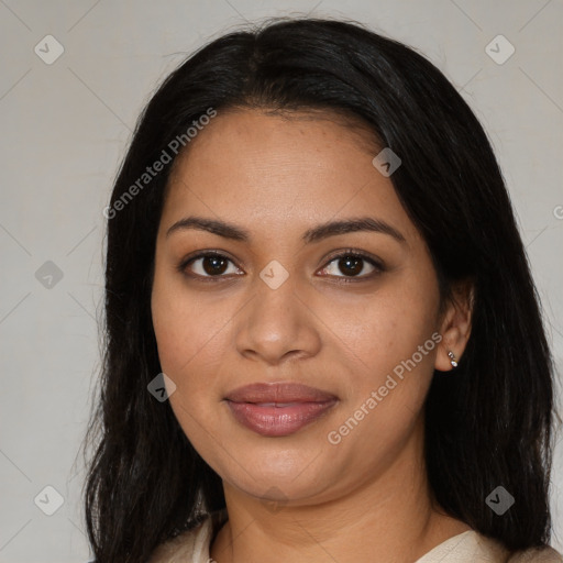 Joyful latino young-adult female with long  brown hair and brown eyes