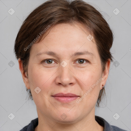 Joyful white adult female with medium  brown hair and grey eyes