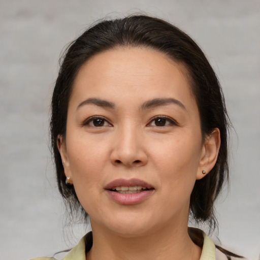 Joyful white young-adult female with medium  brown hair and brown eyes