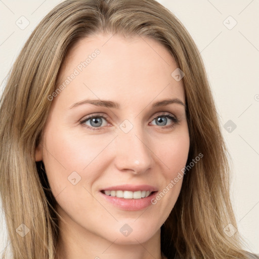 Joyful white young-adult female with long  brown hair and blue eyes