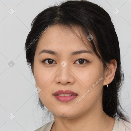 Joyful asian young-adult female with medium  black hair and brown eyes