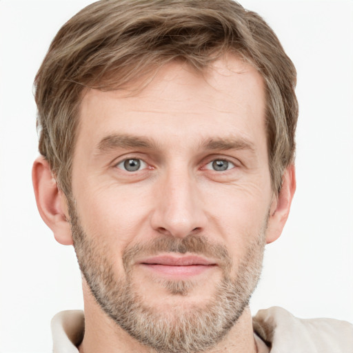 Joyful white adult male with short  brown hair and grey eyes