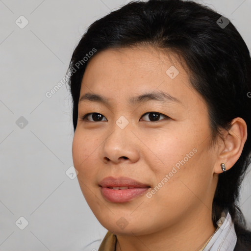 Joyful asian young-adult female with medium  brown hair and brown eyes