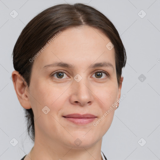 Joyful white young-adult female with medium  brown hair and grey eyes