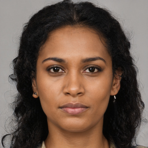 Neutral black young-adult female with long  brown hair and brown eyes