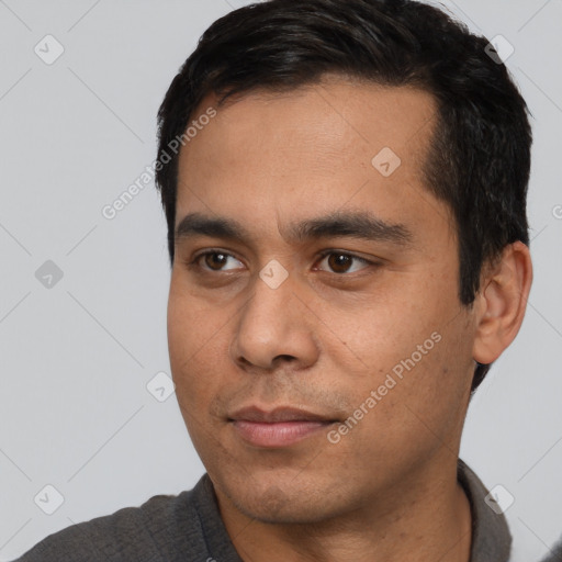 Neutral latino young-adult male with short  black hair and brown eyes