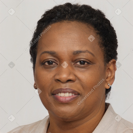 Joyful black adult female with short  brown hair and brown eyes