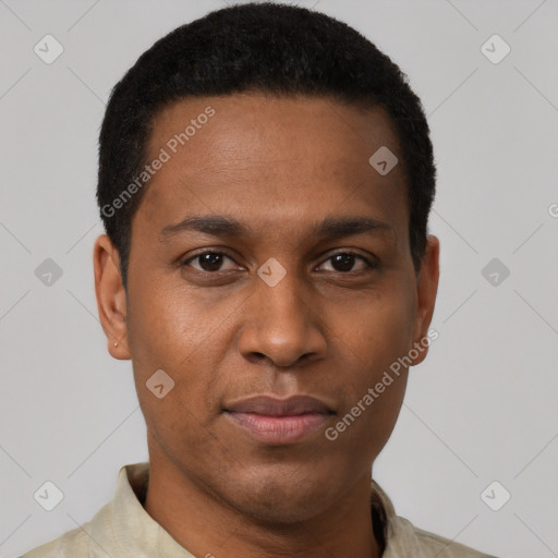 Joyful black young-adult male with short  black hair and brown eyes