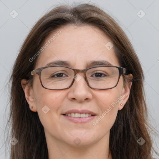 Joyful white adult female with long  brown hair and brown eyes