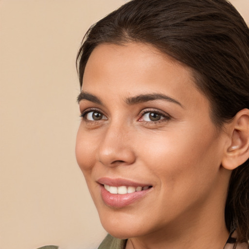 Joyful white young-adult female with medium  brown hair and brown eyes