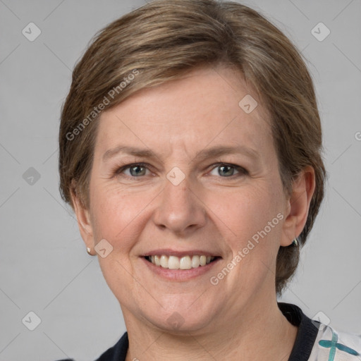 Joyful white adult female with medium  brown hair and grey eyes