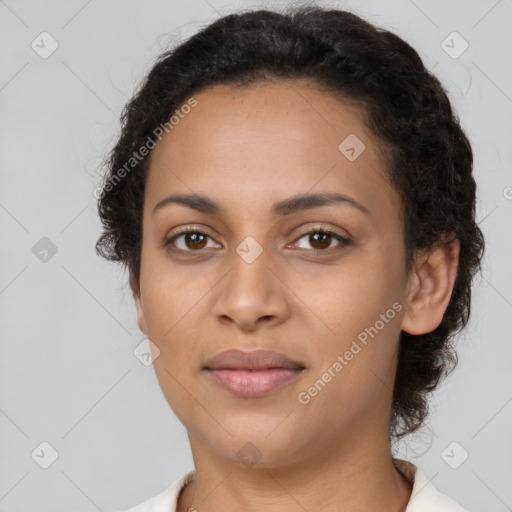 Joyful latino young-adult female with short  brown hair and brown eyes