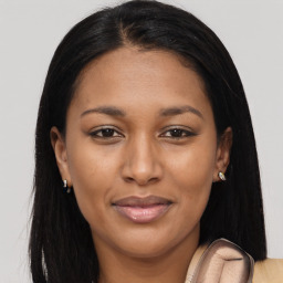 Joyful latino young-adult female with long  brown hair and brown eyes