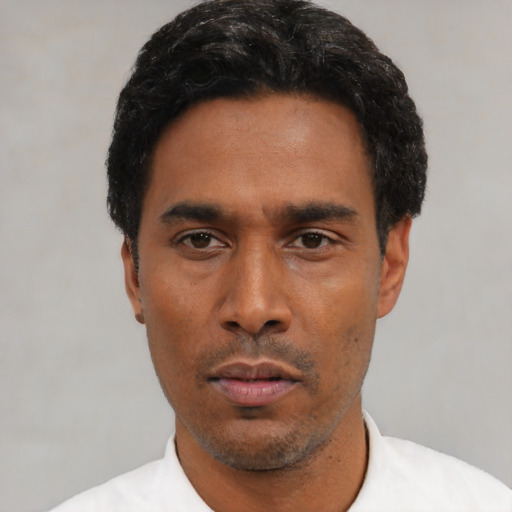 Neutral black young-adult male with short  black hair and brown eyes