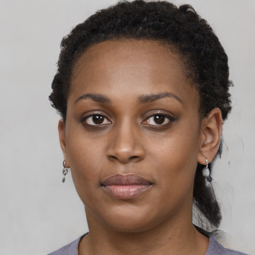 Neutral black young-adult female with short  brown hair and brown eyes