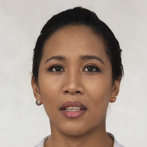 Joyful asian young-adult female with short  black hair and brown eyes