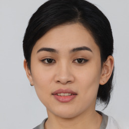 Joyful asian young-adult female with medium  black hair and brown eyes